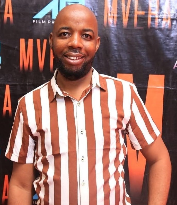 Guy G Posing for a photo at Mvera Red Carpet Event